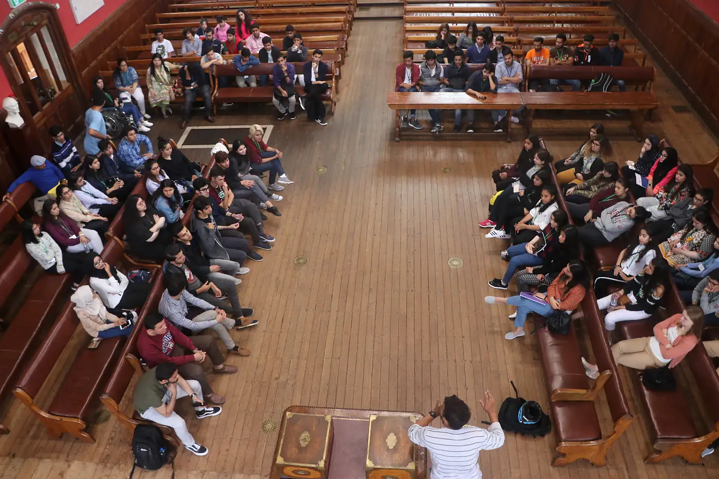 Students debating in the chamber