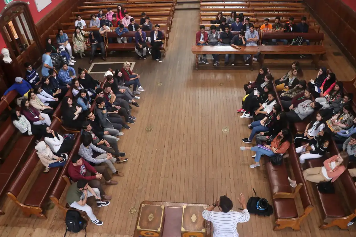 Students debating in the chamber