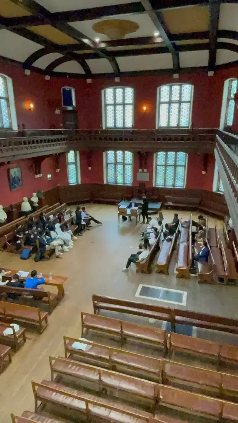 Students in the Oxford Union debating chamber