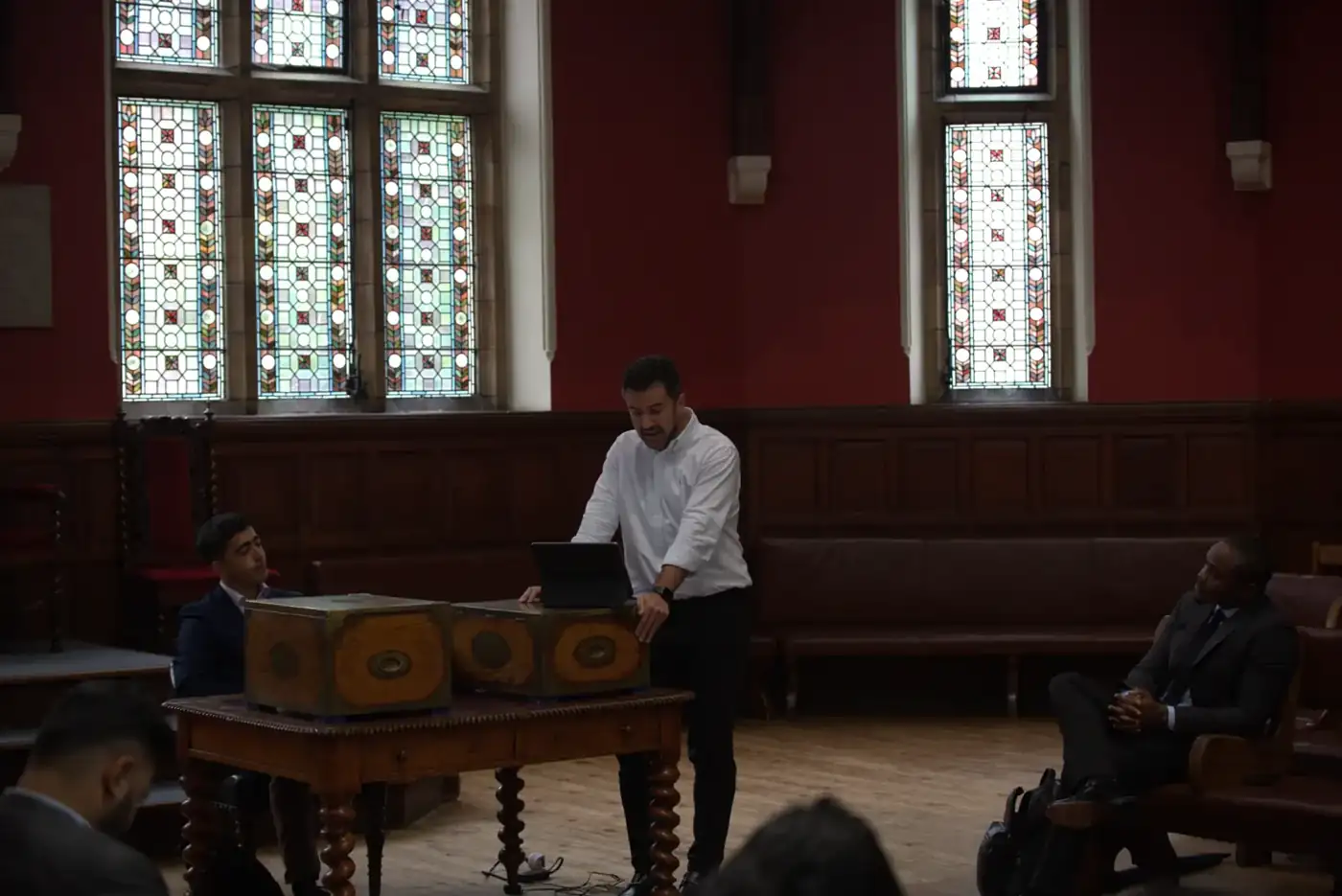 A speaker in a historic debating chamber